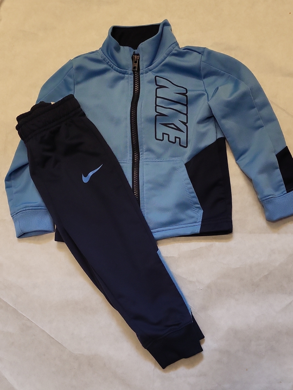 Nike light blue and navy track suit